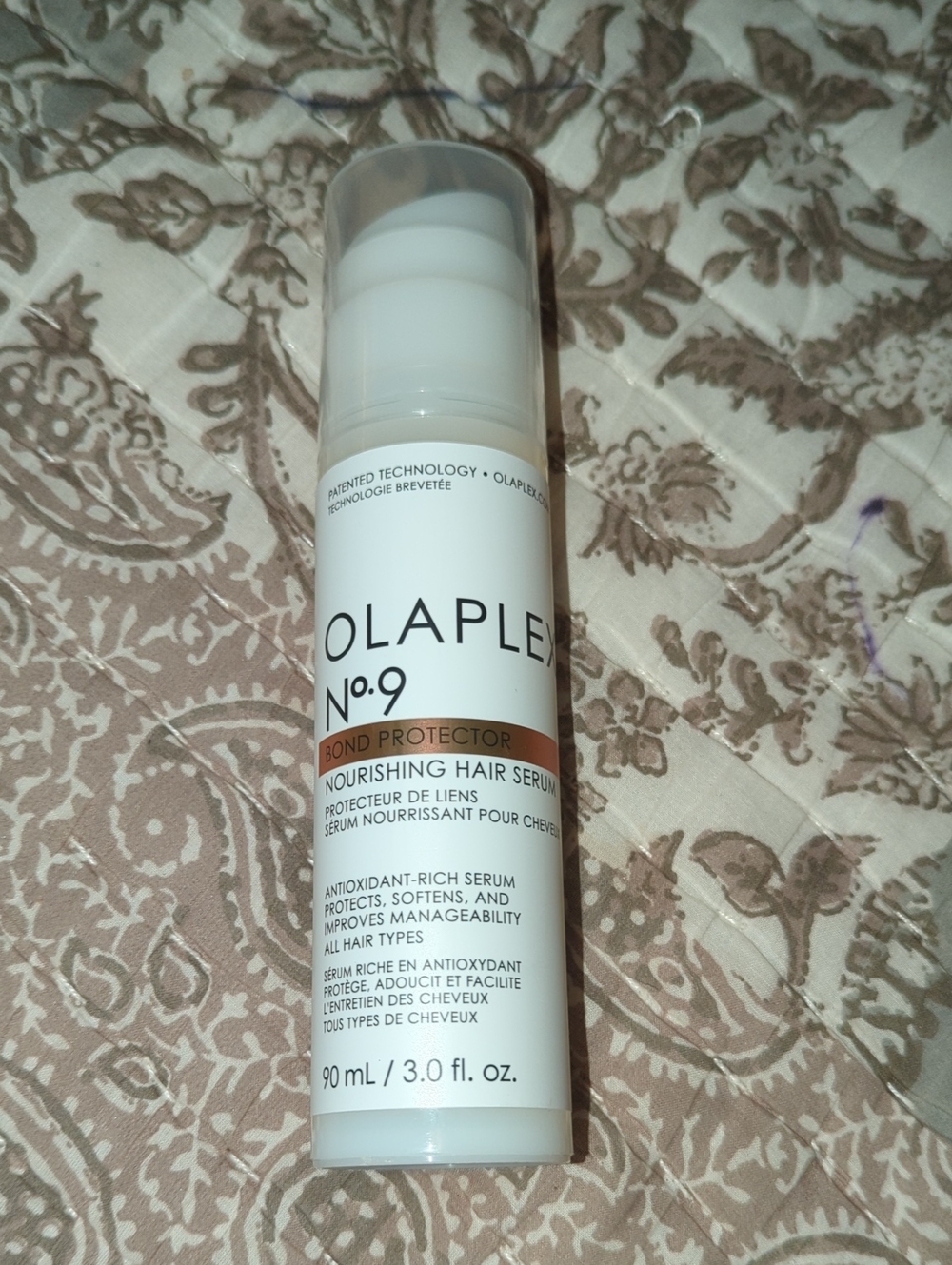 OLAPLEX No.9 Nourishing Hair Serum in White and Brown Accents